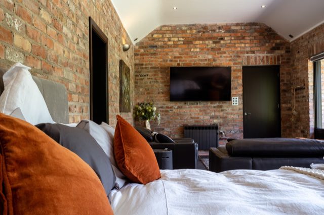 Luxury Lakeview Retreat: View from the bed across the room to the TV