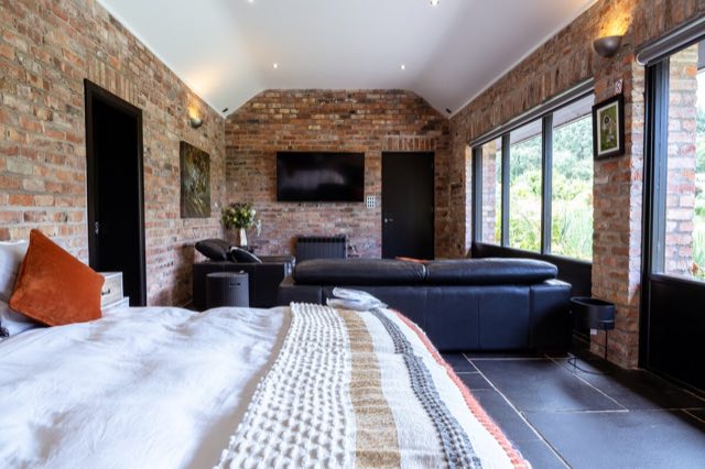 Luxury Lakeview Retreat: View from the bed down the length of the room