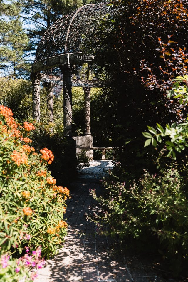 Luxury Lakeview Retreat: Path through flowering planting to the gazebo