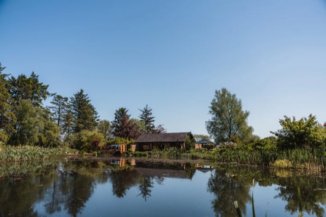 Luxury Lakeview Retreat: The lodge across the still lake