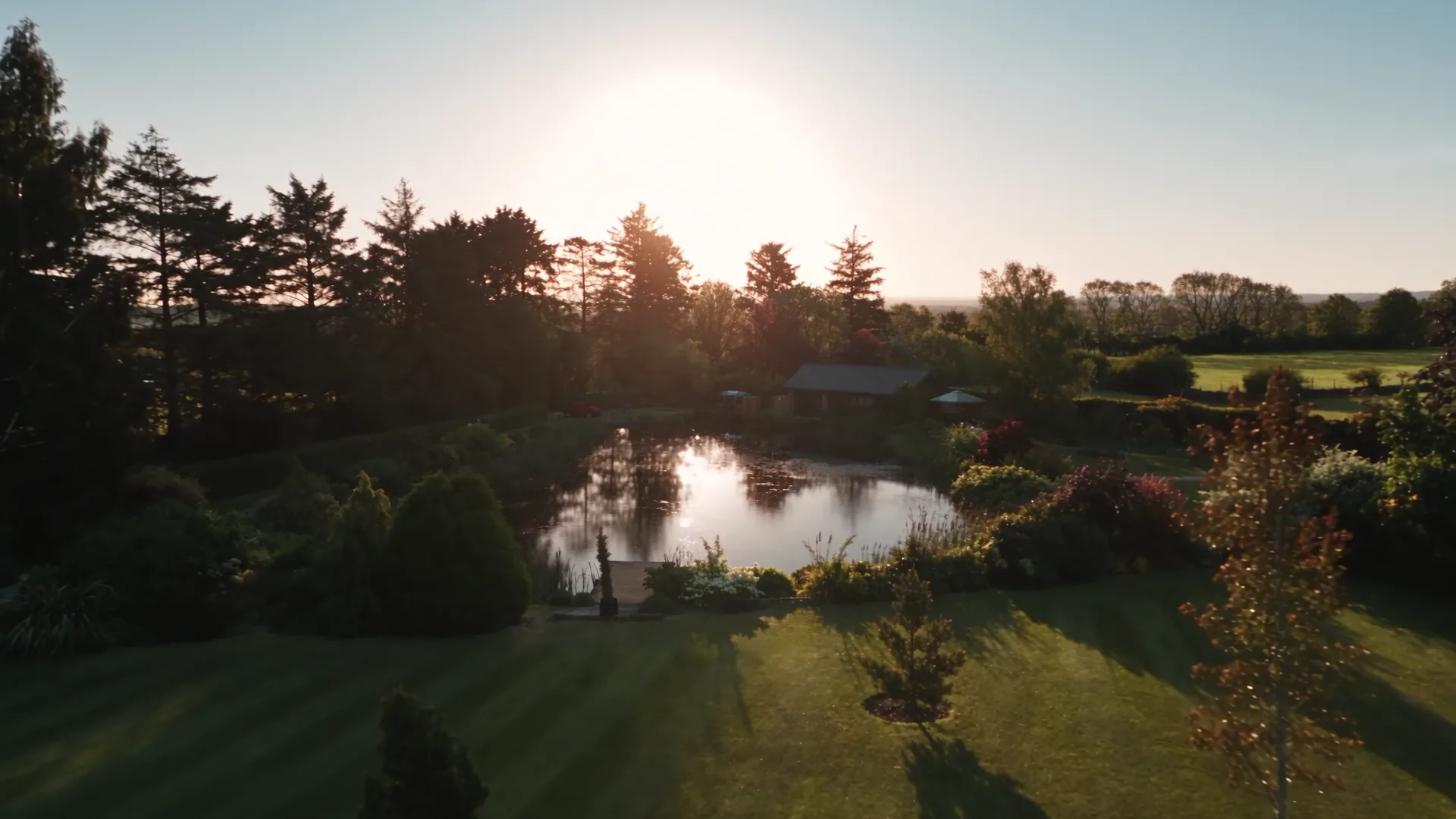 Golden hour over the lake at Springwell Lodges